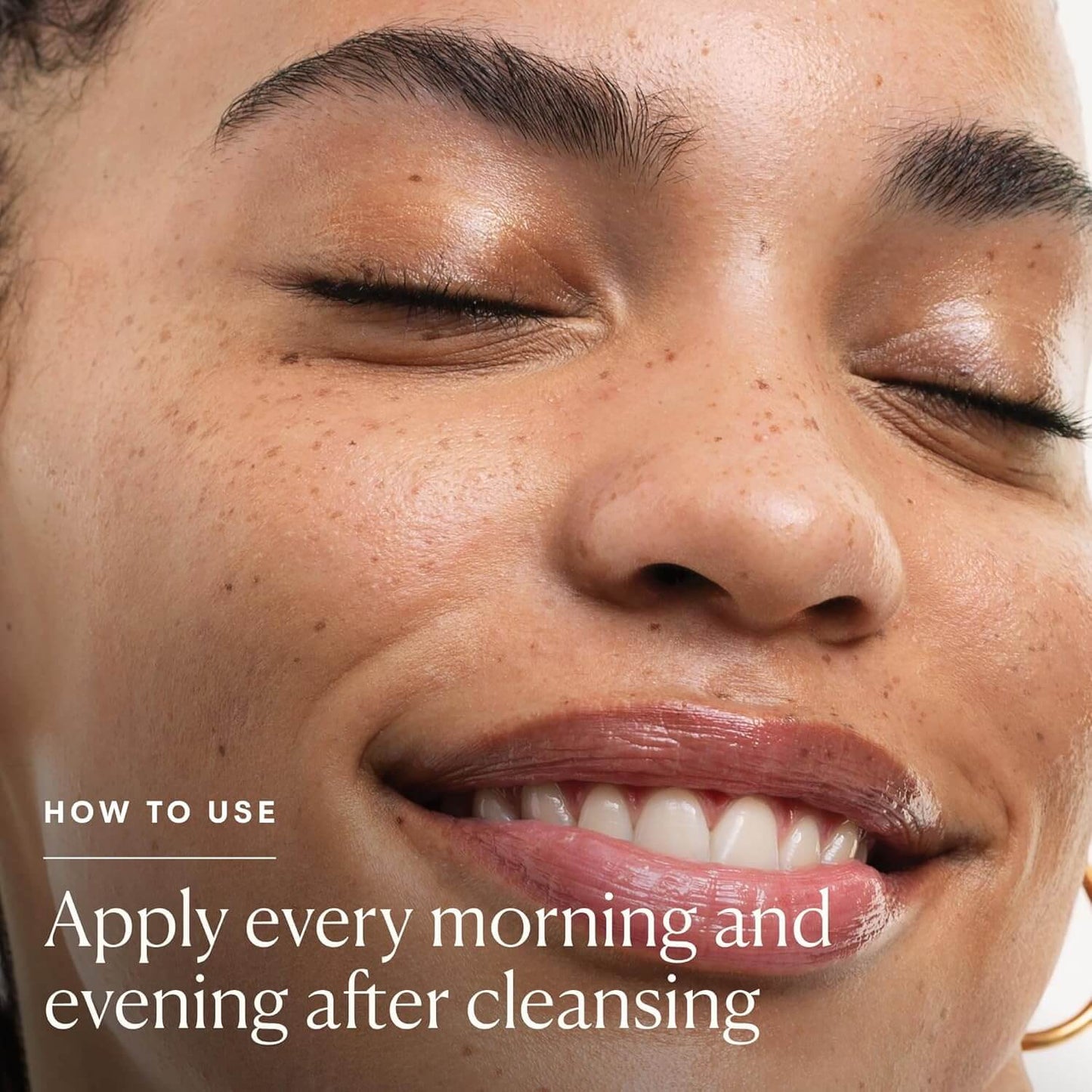 Close-up of a woman's face with text on how to use a Elemis product, set against a neutral background.