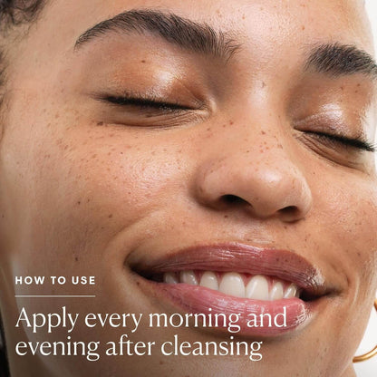 Close-up of a woman's face with text on how to use a Elemis product, set against a neutral background.