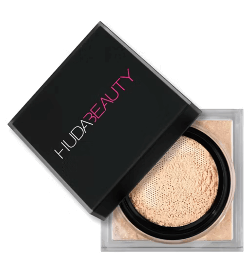 Huda Beauty Easy Bake Loose Baking & Setting Powder in a sleek black container, showcasing its silky smooth texture.