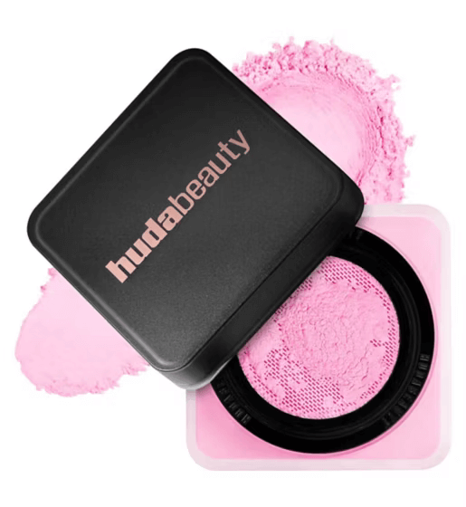 Huda Beauty Easy Bake Loose Baking & Setting Powder in pink packaging, showcasing silky texture for a flawless finish.