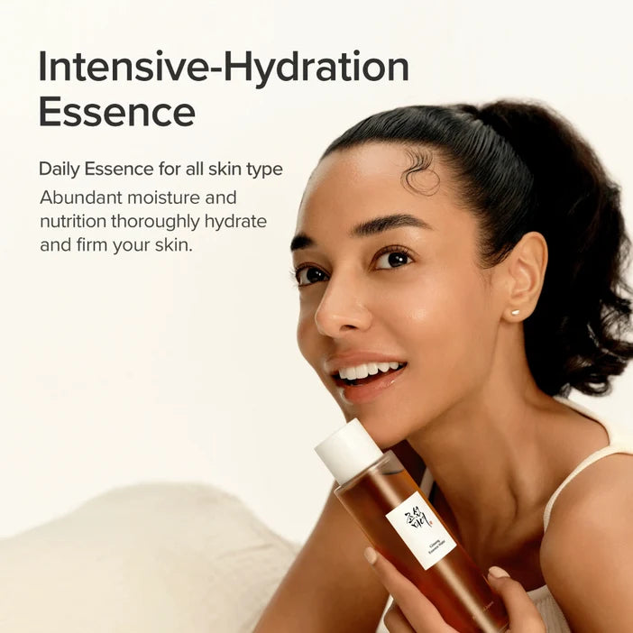 Woman holding a bottle of Intensive-Hydration Essence with text about its benefits.