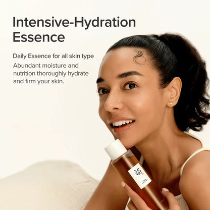 Woman holding a bottle of Intensive-Hydration Essence with text about its benefits.