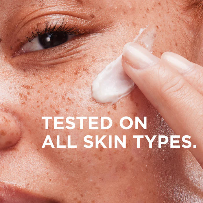 Person applying IT Cosmetics  cream to their face with text 'TESTED ON ALL SKIN TYPES.'