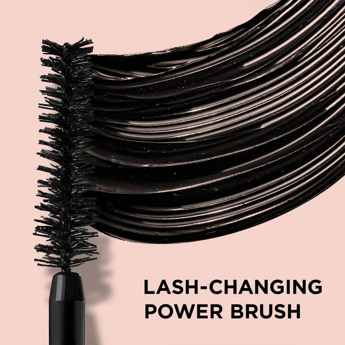 Lash-changing power brush with black bristles on a pink background IT Cosmetics 