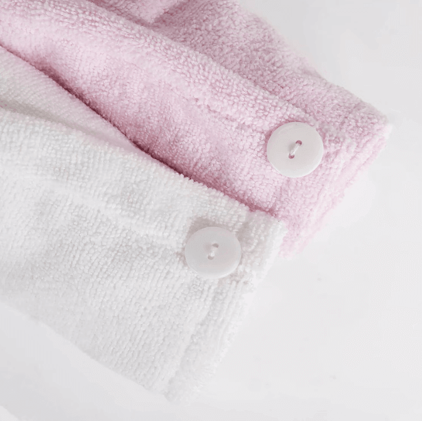 Brushworks Hair Wrap showing soft microfiber fabric in pink and white with button fastening for secure wear.