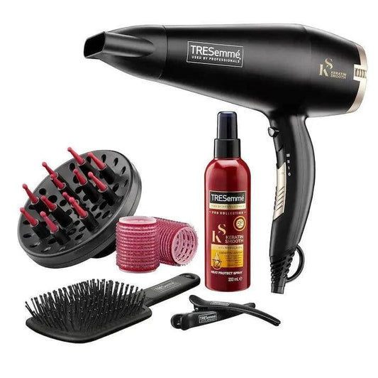 TRESemmé Salon Smooth Blow Dry Collection Kit with hairdryer, diffuser, styling products, and accessories for salon-quality styling.