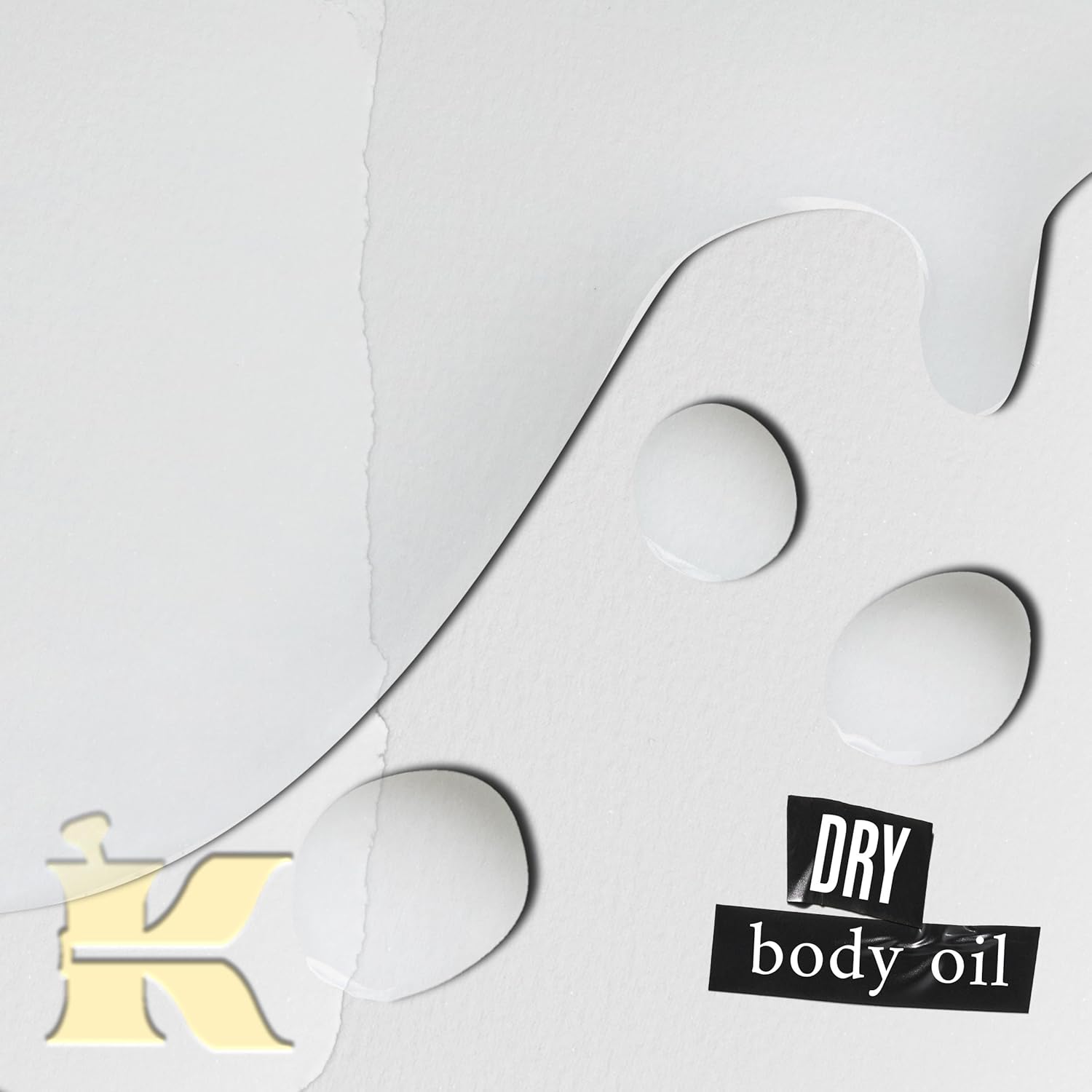 Kiehl's Dry body oil packaging with a gold logo and text on a white background