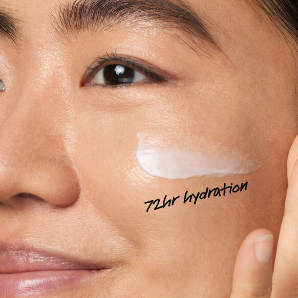 Close-up of a person's face with a Kiehl's skincare product applied, labeled '72hr hydration'.