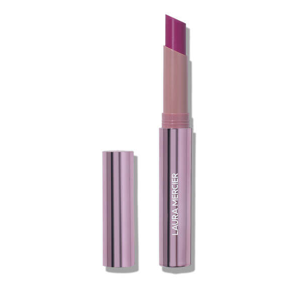 Laura Mercier lipstick with pink shade on a white background