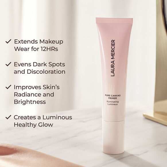 Laura Mercier primer tube with product benefits listed on a neutral background