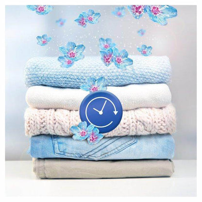 Stack of folded clothes featuring blue and pink flowers, symbolizing freshness with Lenor scent booster.