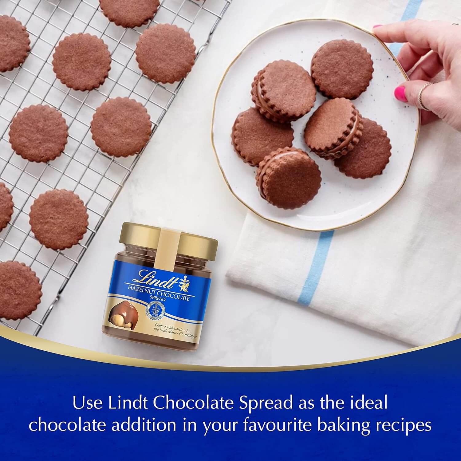 Lindt chocolate spread jar with cookies on a plate and cooling rack
