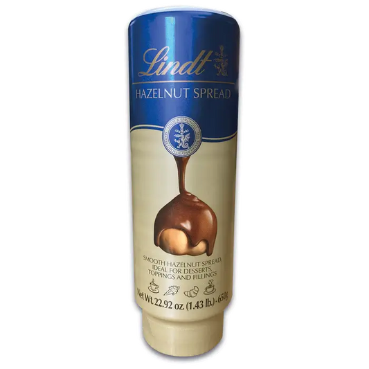 Lindt Hazelnut Milk Chocolate Spread 650g bottle, ideal for desserts, toppings, and transforming breakfasts.