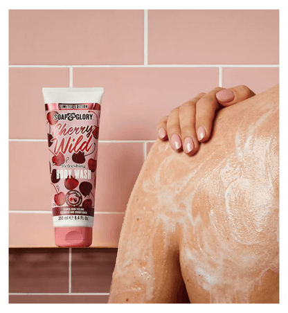 Soap & Glory Cherry Wild Refreshing Body Wash with dark cherry fragrance on a pink tiled background.