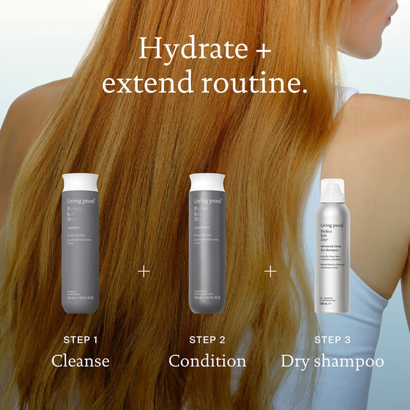 Hair care routine with three products labeled Living Proof 'Cleanse', 'Condition', and 'Dry shampoo' on a blurred background of a person with long hair.