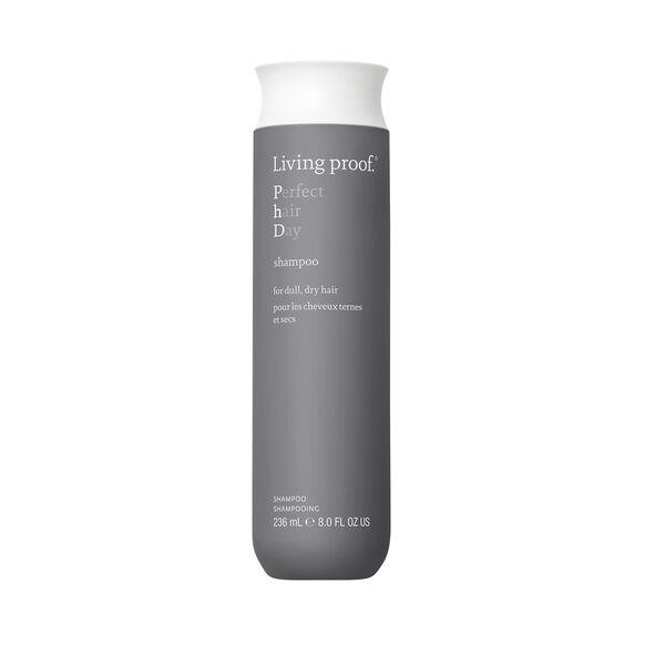 Living Proof shampoo bottle on a white background