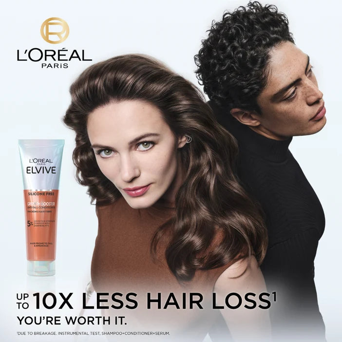 L'Oreal Paris Elvive shampoo bottle with a woman and man with styled hair on a white background