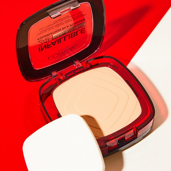 L'Oreal Makeup compact with red case on a white background
