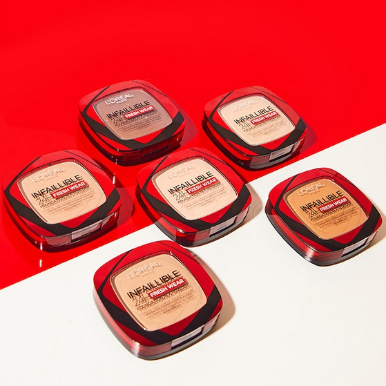 Set of L'Oreal Infallible makeup products on a red background