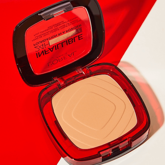 L'Oreal Makeup compact with beige powder on a red and white background