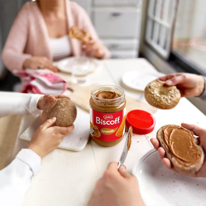 People preparing sandwiches with Lotus Biscoff spread in a kitchen setting
