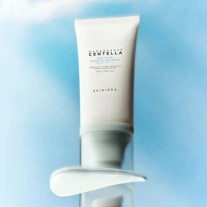Skincare tube with 'Skin 1004' branding on a blue gradient background
