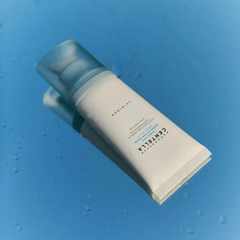 Skincare bottle with pump on a blue background