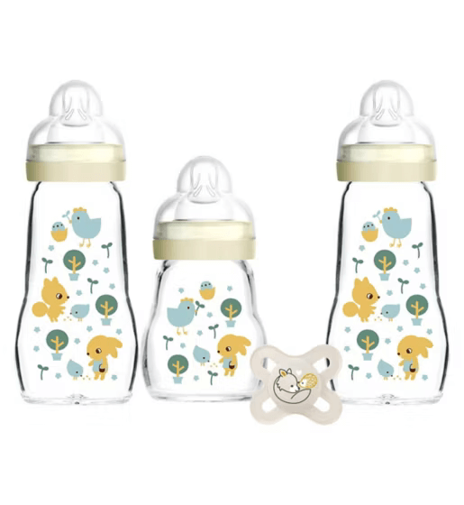 MAM Glass Baby Bottle Set with two decorated bottles, one small bottle, and MAM Start Soother for infants.
