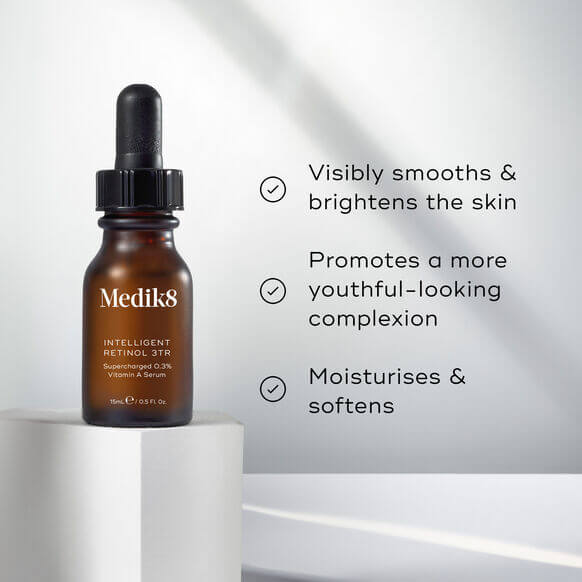 Medik8 skincare serum bottle with text on a light background