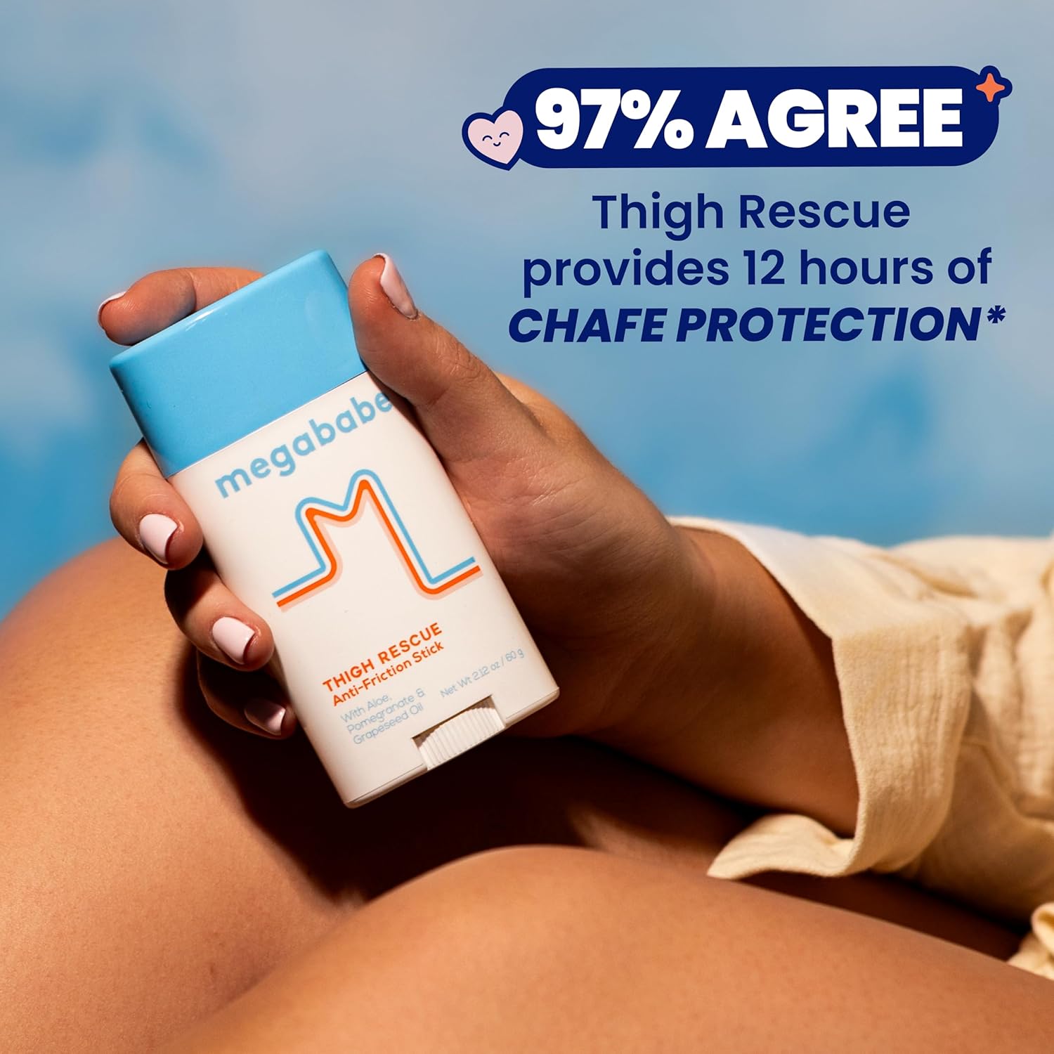 Hand holding a Megababe Thigh Rescue stick with text about chafe protection on a blue background