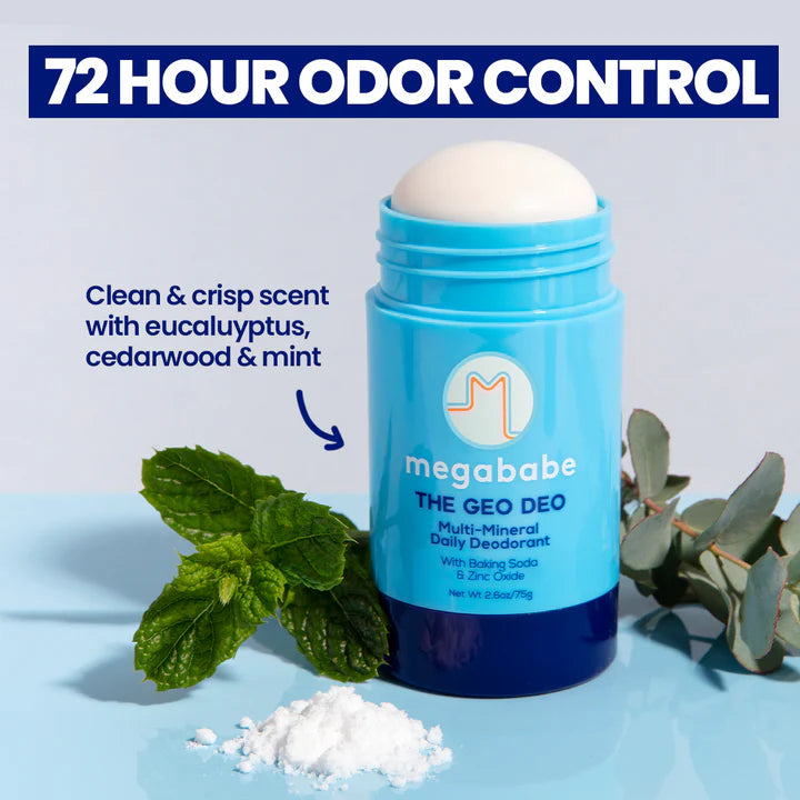 Megababe Blue deodorant stick with eucalyptus leaves on a light blue background