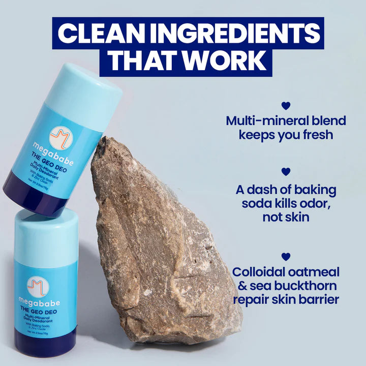 Two bottles of Megababe deodorant with a rock and text about product ingredients on a light gray background