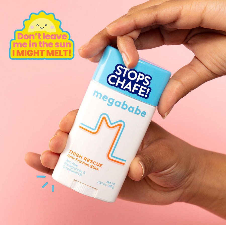Hand holding a 'megababe' anti-chafe stick with a pink background and text.