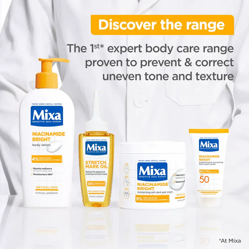Mixa body care products with a white background