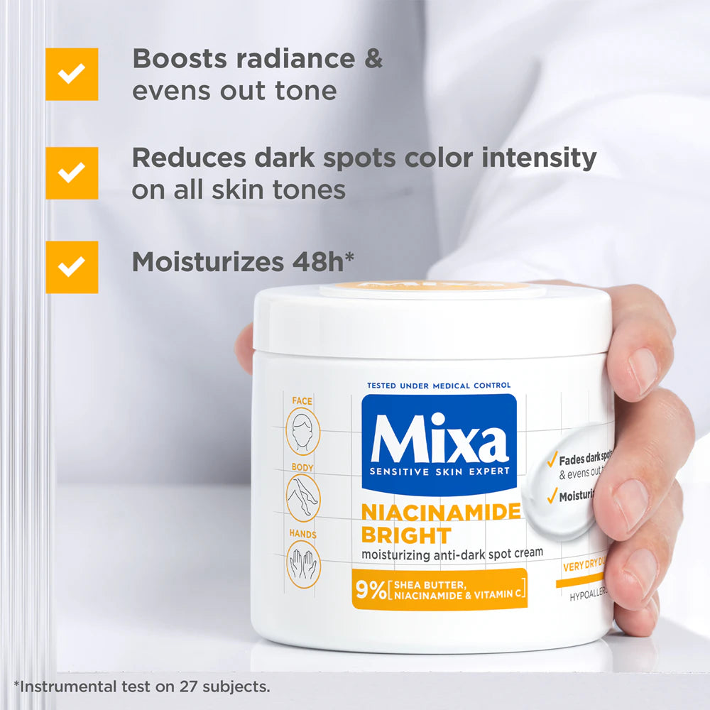 Hand holding a jar of Mixa Niacinamide Bright cream with product features listed.