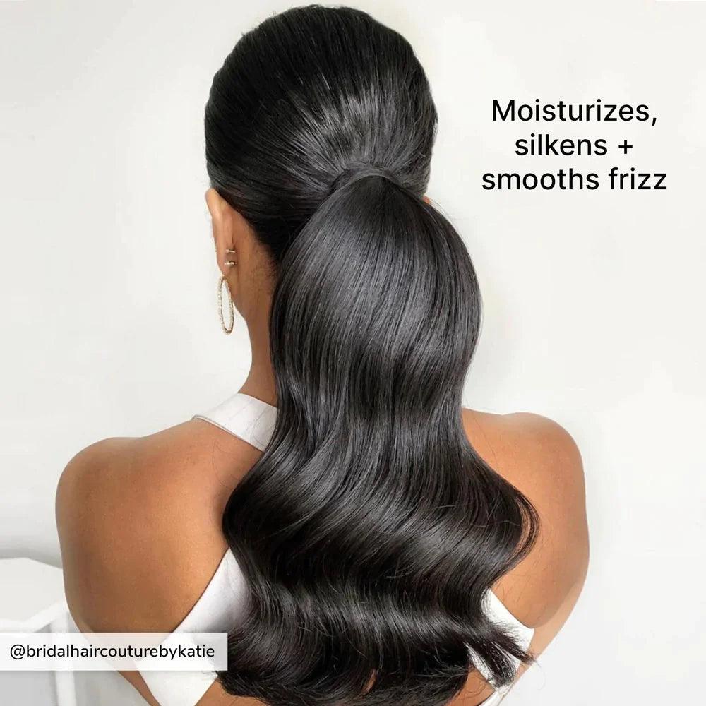 color wow Woman's sleek hairstyle showcasing shine and smoothness, emphasizing moisture and frizz control for healthy-looking hair.