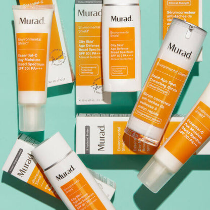 Collection of Murad skincare products on a teal background