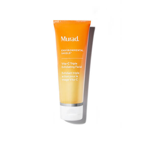 Orange tube of Murad skincare product on a white background