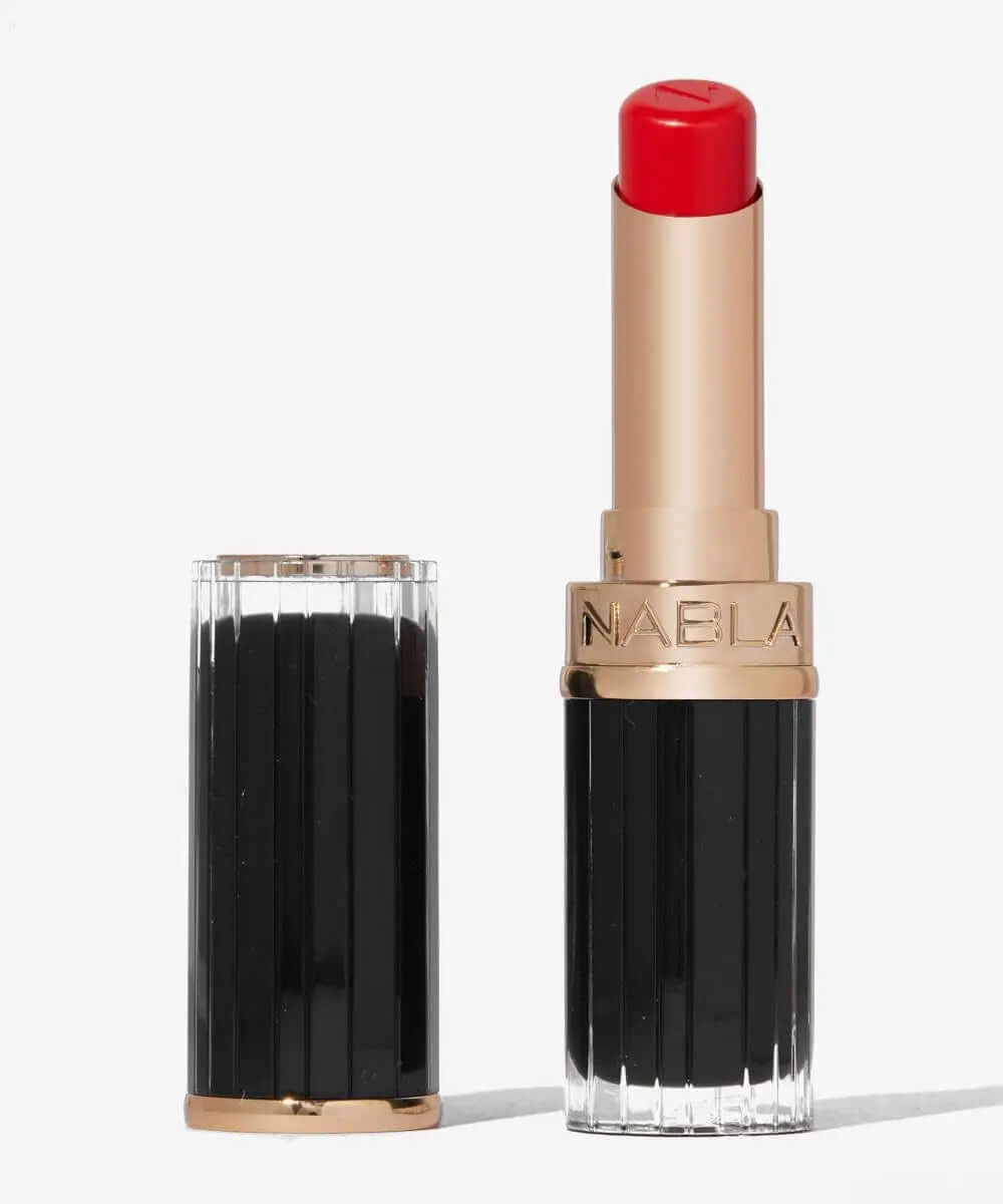 NABLA Beyond Jelly Lipsick in vibrant red color, glossy finish, showcasing elegant packaging.
