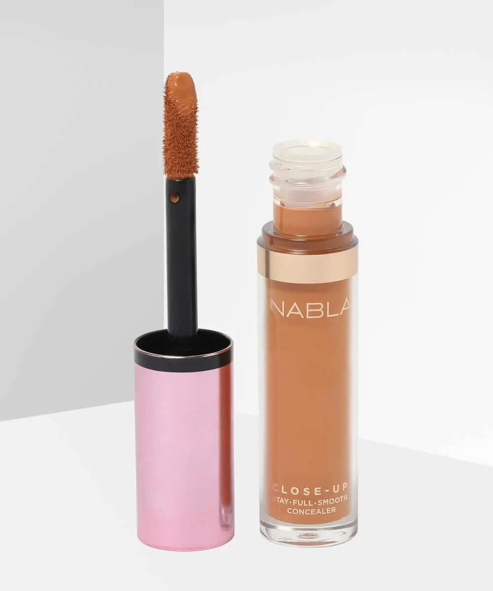 NABLA Close Up Concealer in a bottle with applicator, offering full coverage and a smooth finish, suitable for all skin types.