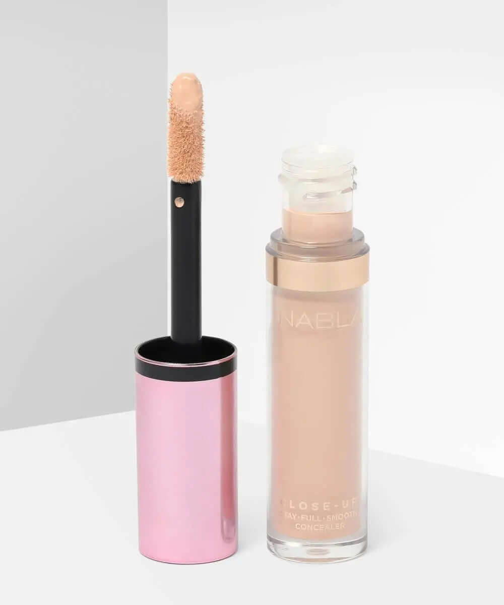 NABLA Close Up Concealer in a sleek bottle with an applicator, showcasing its creamy formula for flawless coverage.