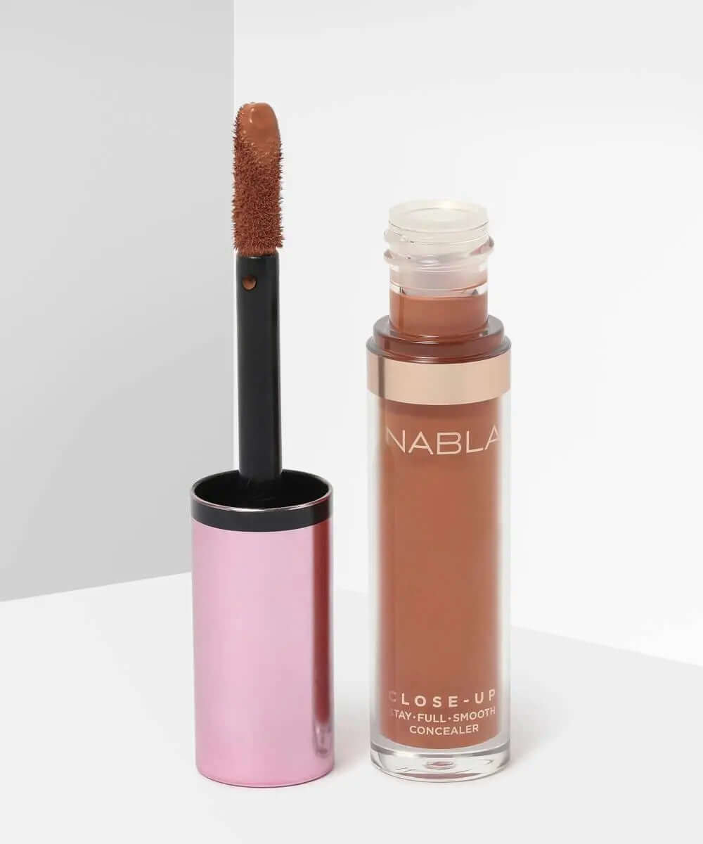 NABLA Close Up Concealer in brown shade with applicator, offering full coverage for flawless skin.