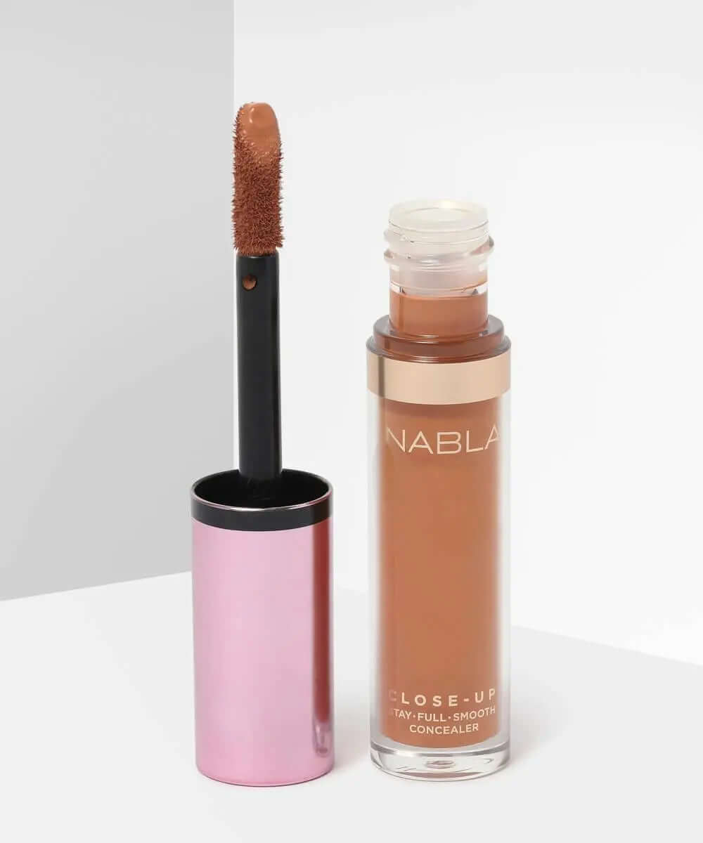 NABLA Close Up Concealer in a sleek bottle with applicator, perfect for covering imperfections with full coverage.