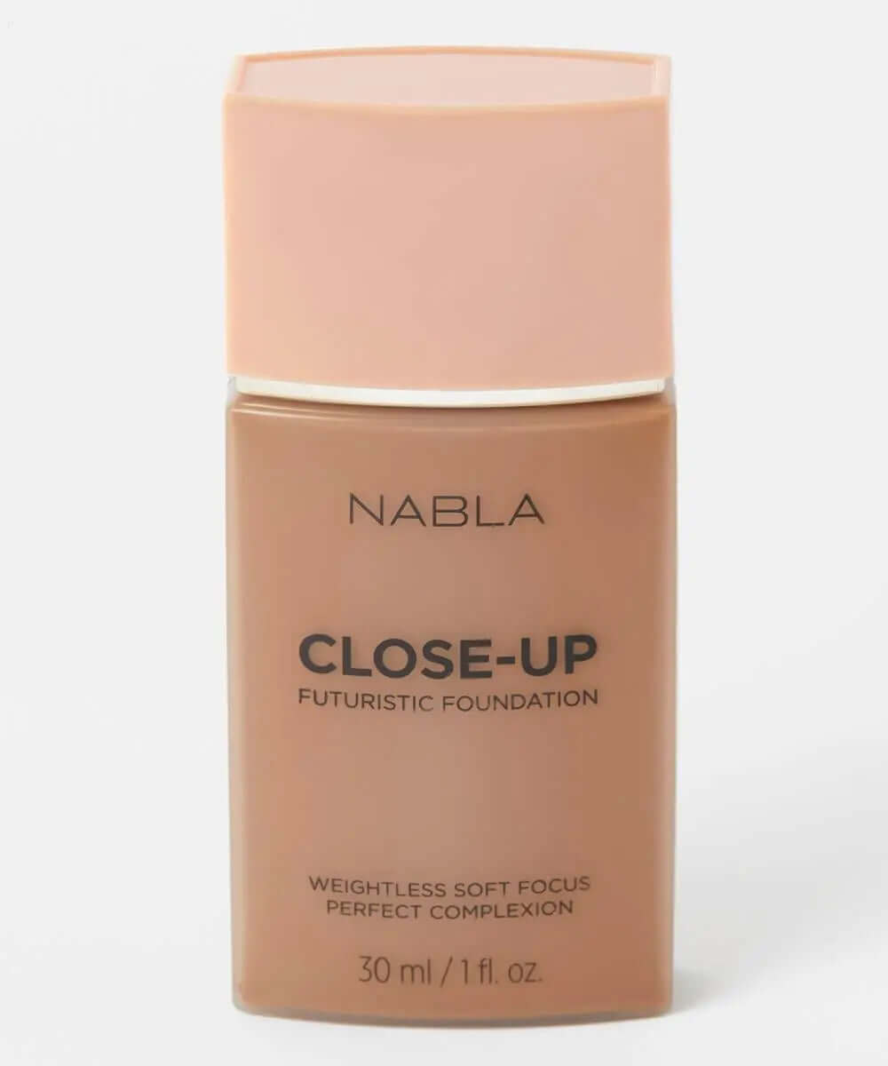 NABLA Close Up Futuristic Foundation in a tan bottle, offering weightless coverage for a perfect complexion.