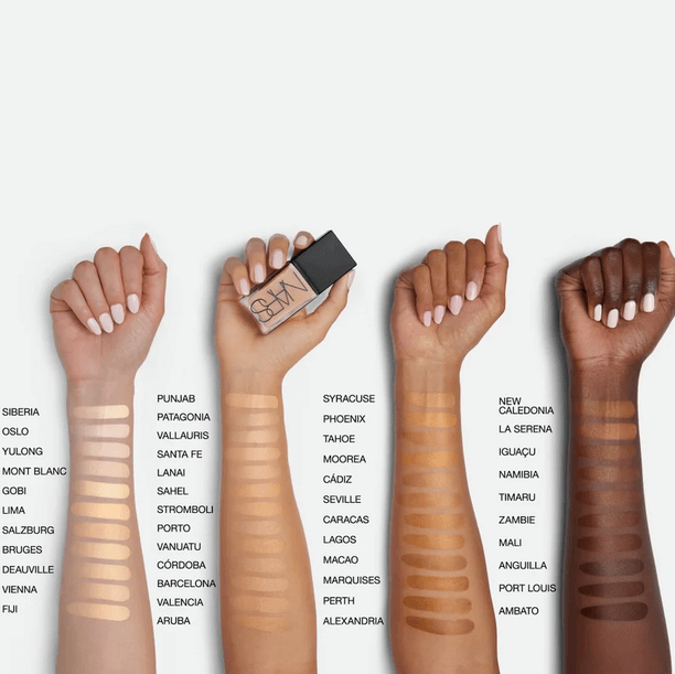 NARS Light Reflecting Foundation shade swatches on diverse skin tones, showcasing a range of options for every beauty need.