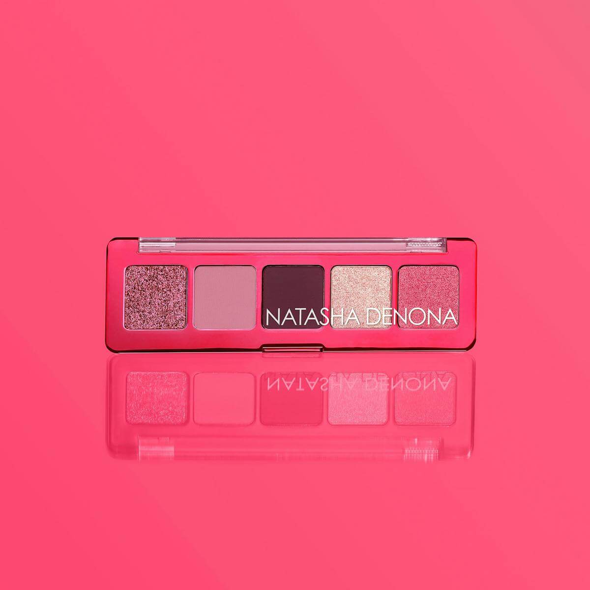 Makeup palette with 'NATASHA DENONA' branding on a pink background