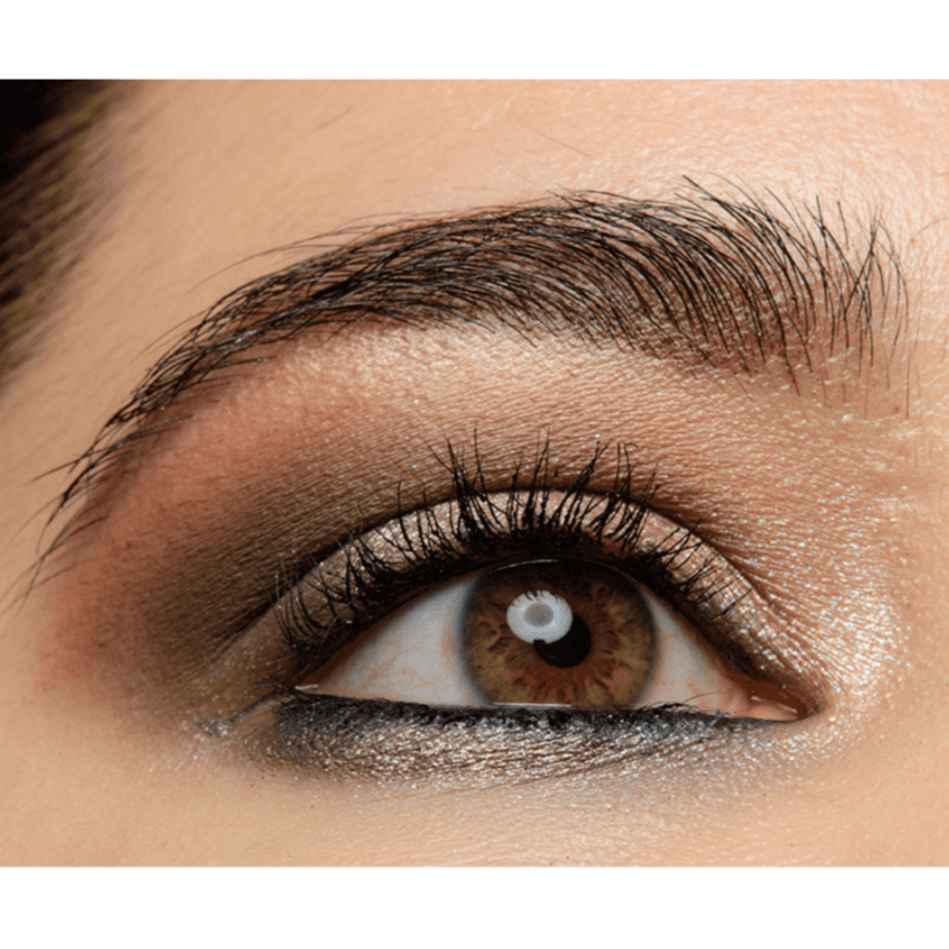 Close-up of an eye showcasing a glamorous retro makeup look with brown and gold eyeshadow shades.