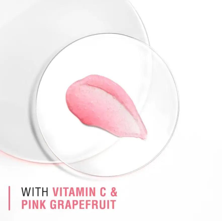 Pink grapefruit and vitamin C facial scrub on a glass dish for Neutrogena Refreshingly Clear Exfoliator.