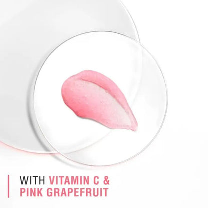Pink grapefruit and vitamin C facial scrub on a glass dish for Neutrogena Refreshingly Clear Exfoliator.
