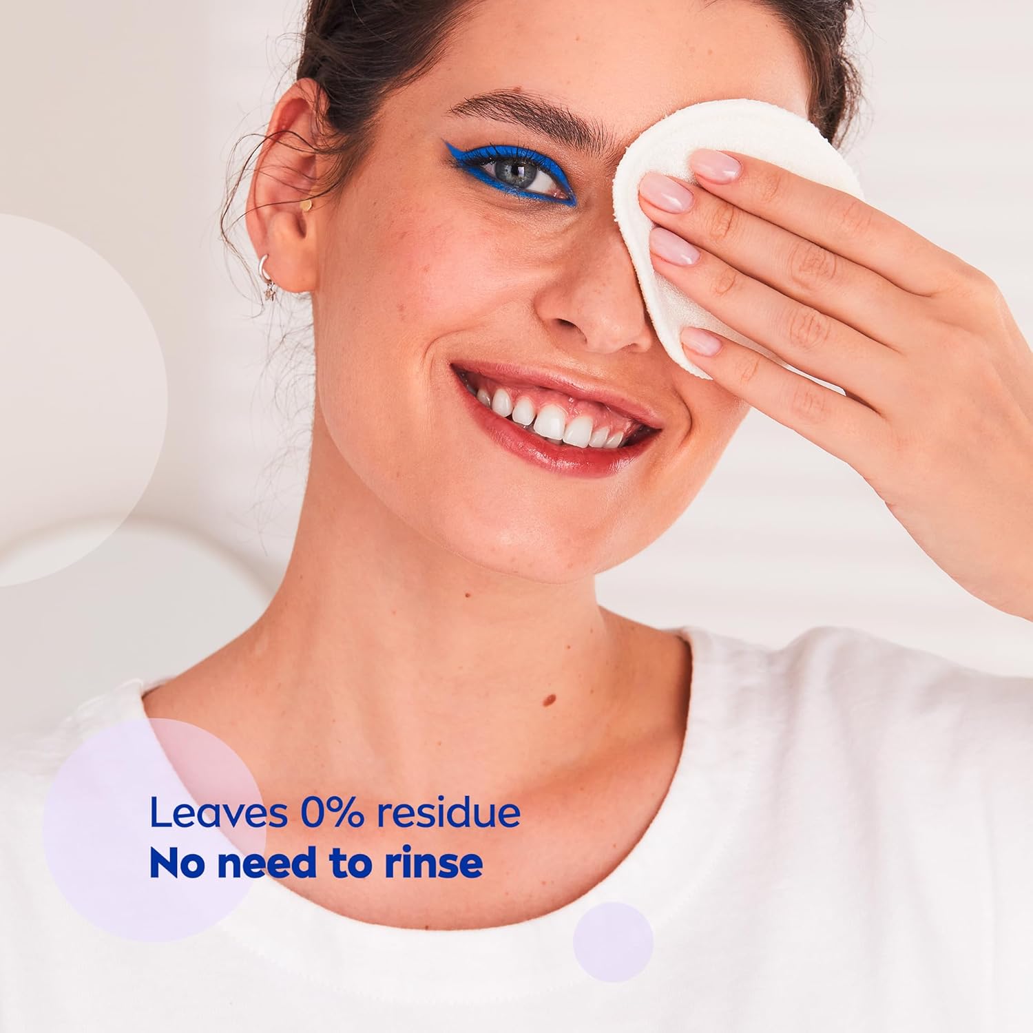 Woman cleaning her face with a white cloth, with text about NIVEA product benefits.